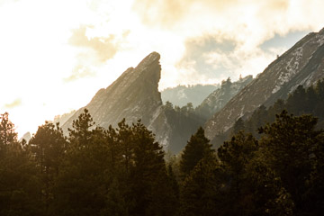 Massive rock formation leaning at a 45 degree angle shear rock face with a sunset to the left